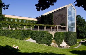 Aarhus University building with lush greenery growing on it